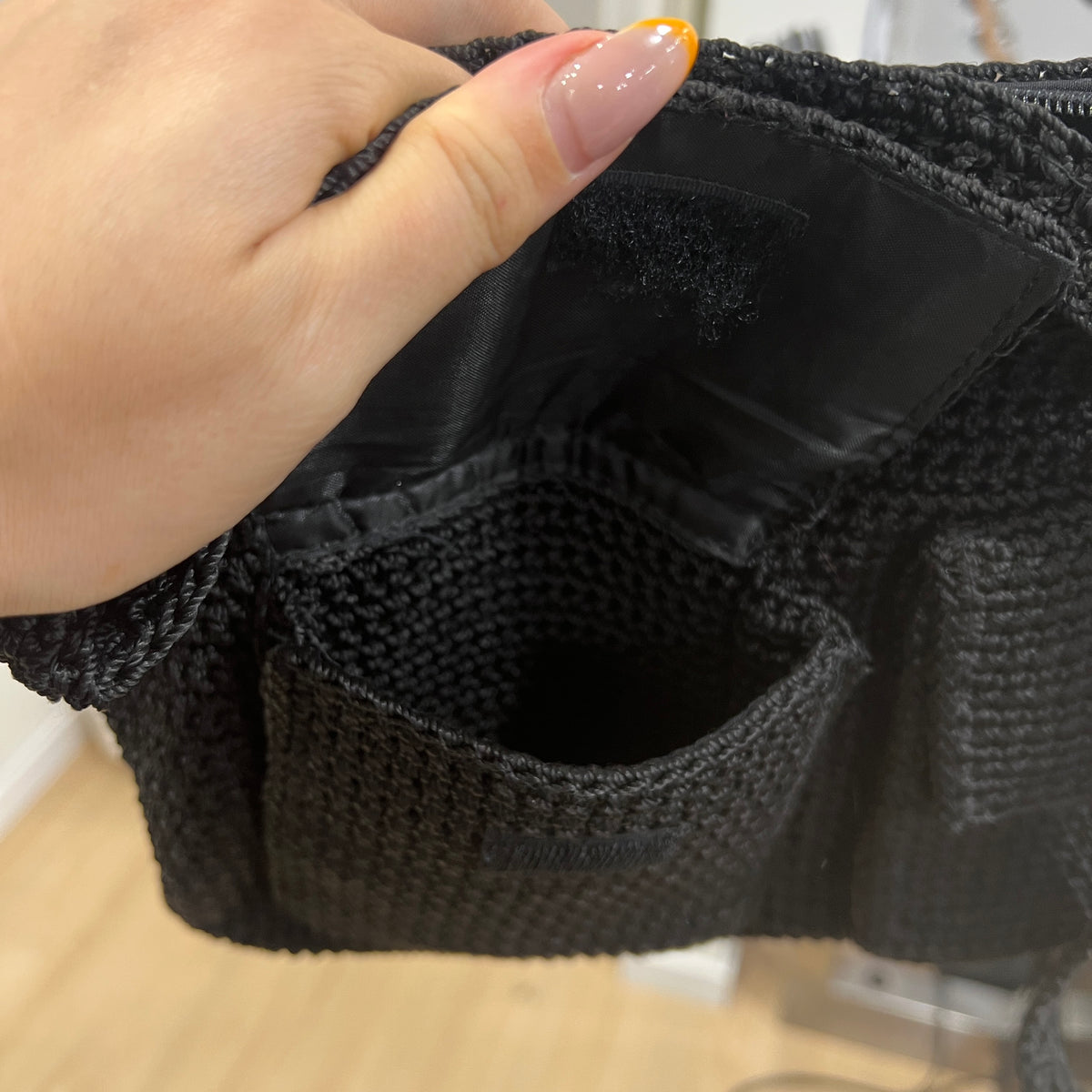 black knit cross body bag with pockets