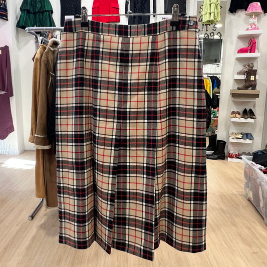 Plaid skirt hanging on a rack in a store setting