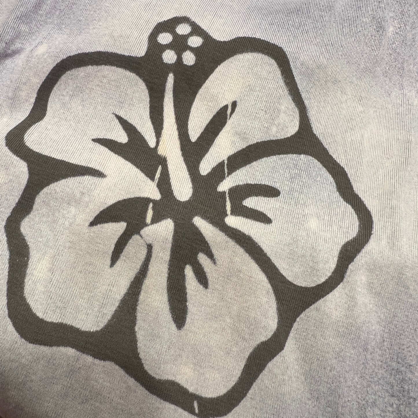 reworked khaki tank top with diagonal cut and hawaiian flowers bleach print