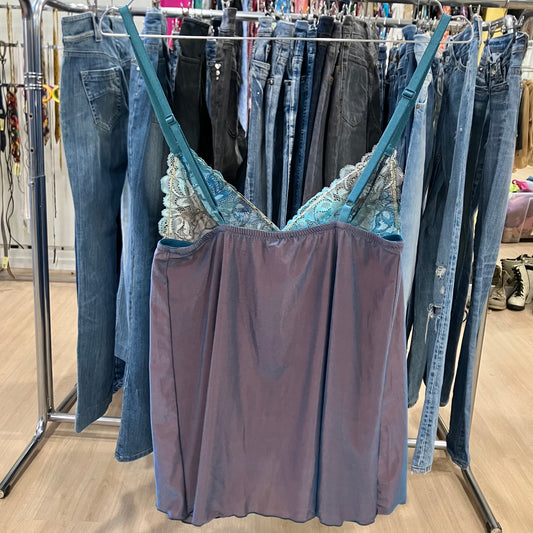 Purple lace-trim slip dress hanging on a rack inside a clothing store