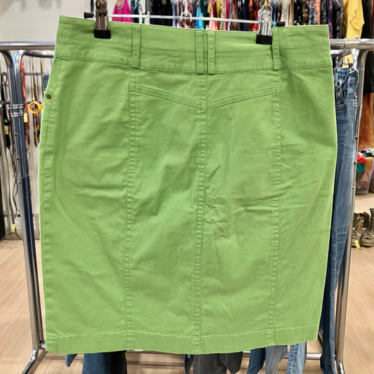 Green skirt on a rack in a store setting