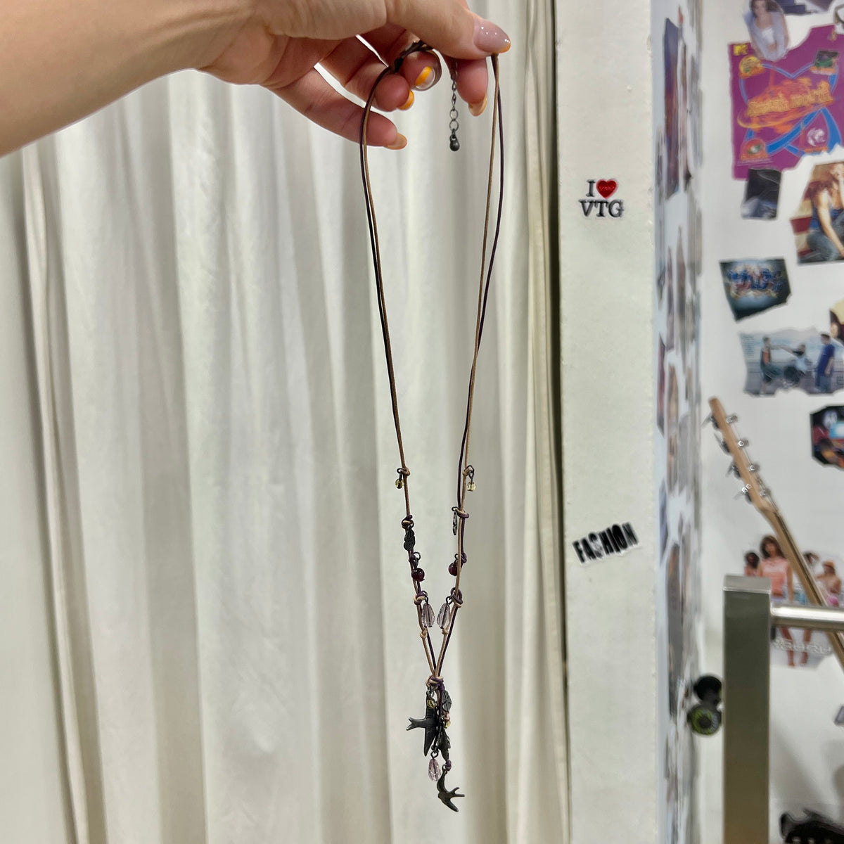 boho whimsy string necklace with silver floral and swallow pendants