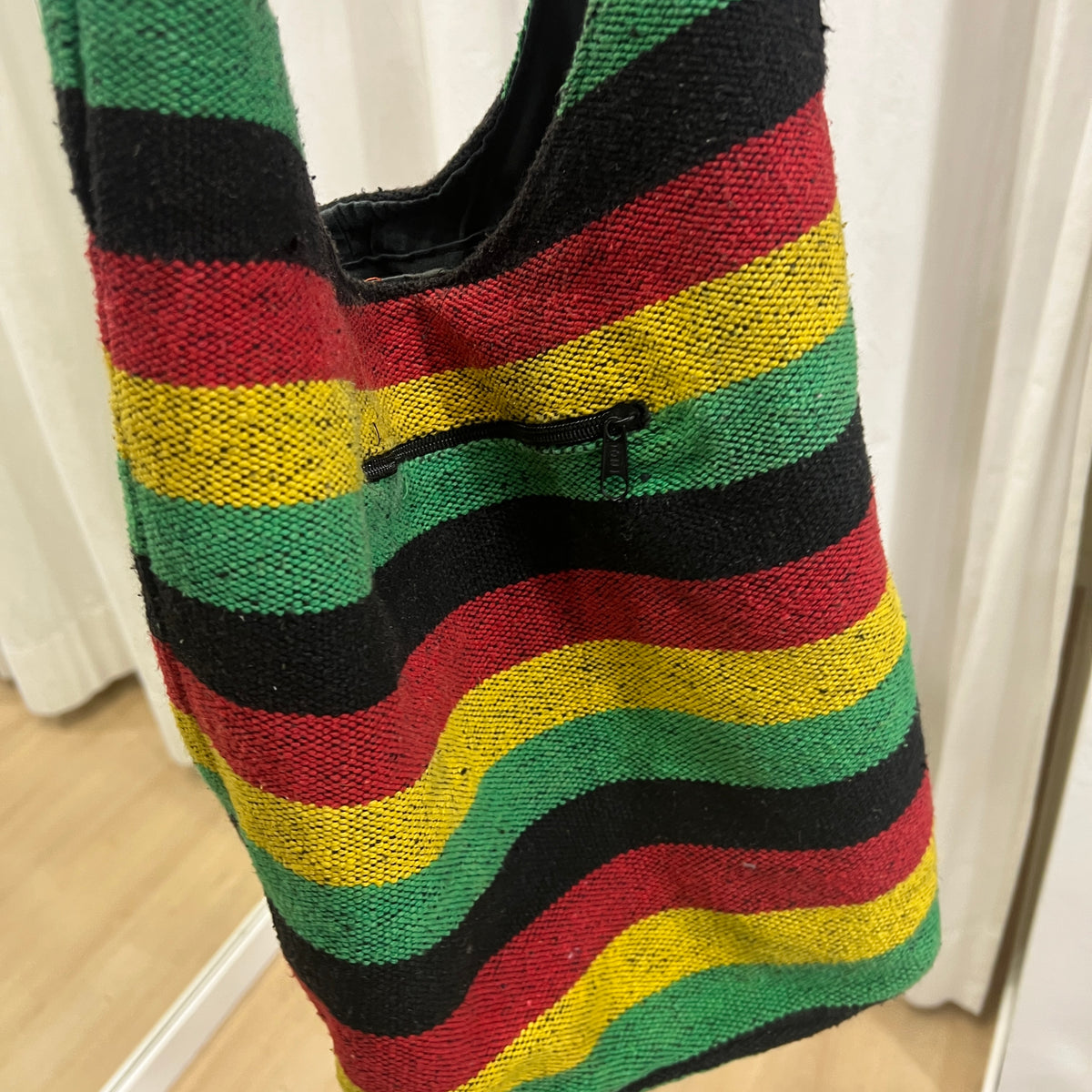 black red yellow green striped hobo bag