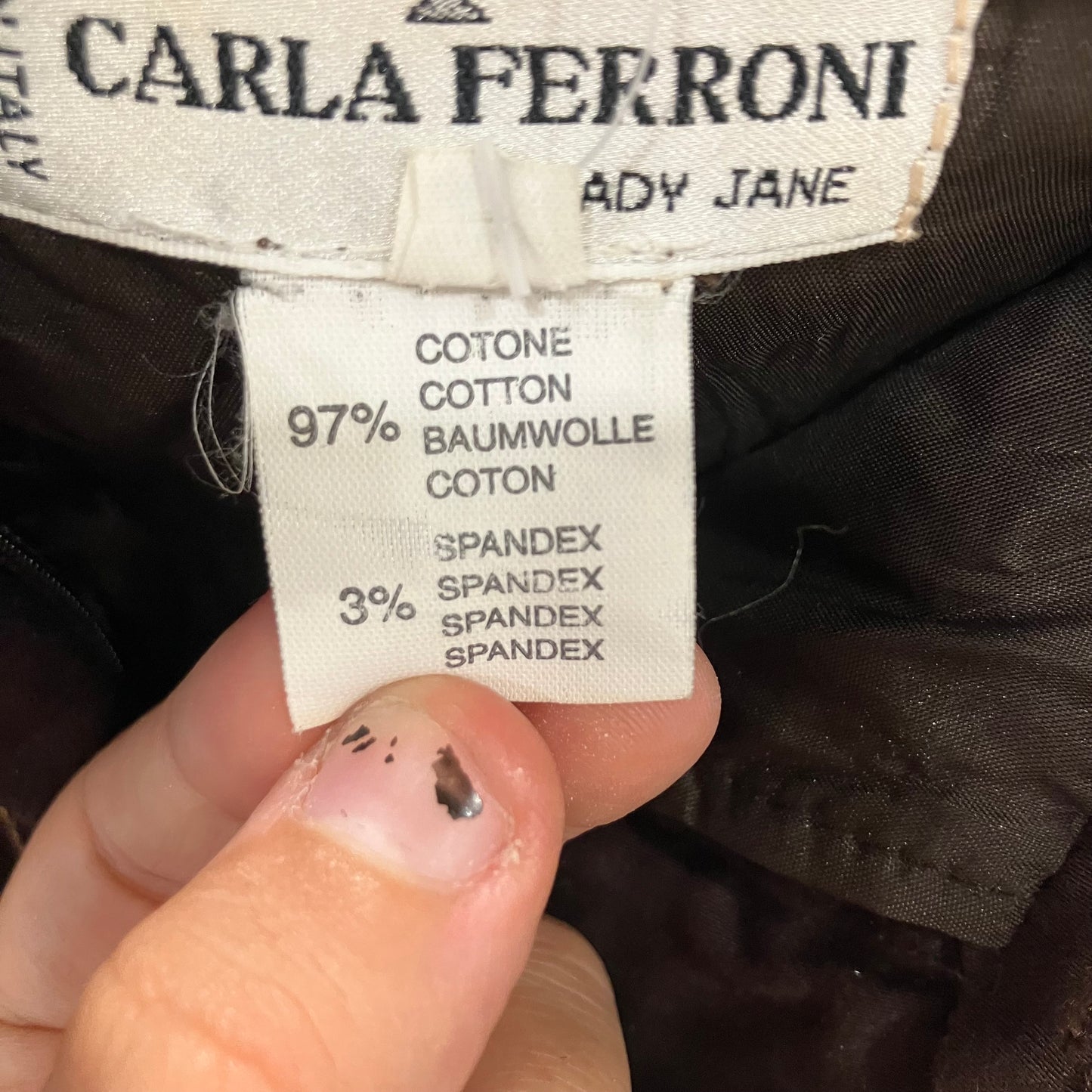 Clothing label with 'Carla Ferroni' brand name and fabric composition details