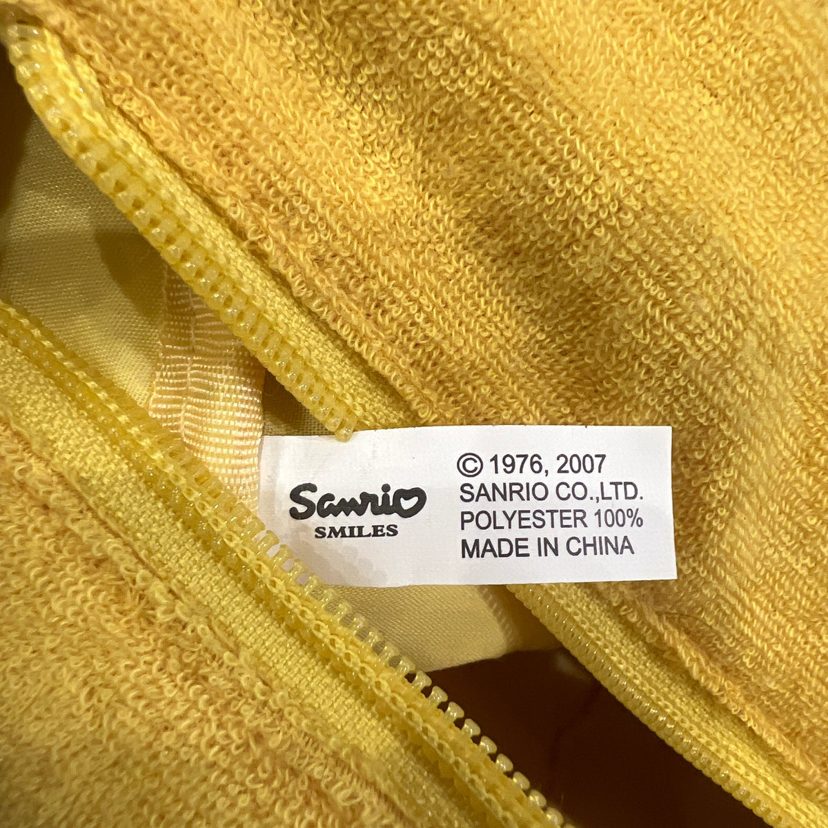 hello kitty sanrio 2007 yellow terry cloth mini trunk bag with white details and silver studs