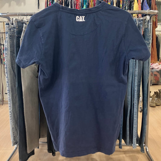 Navy blue t-shirt with 'CAT' logo on a clothing rack