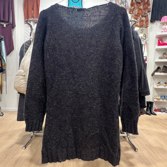 Dark gray sweater dress on a rack in a store setting