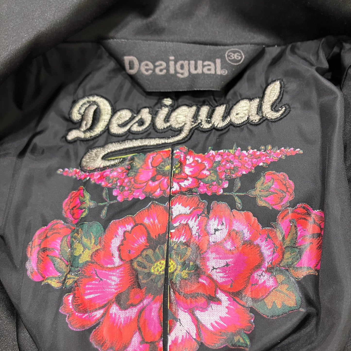 Black jacket with floral embroidery and 'Desigual' branding