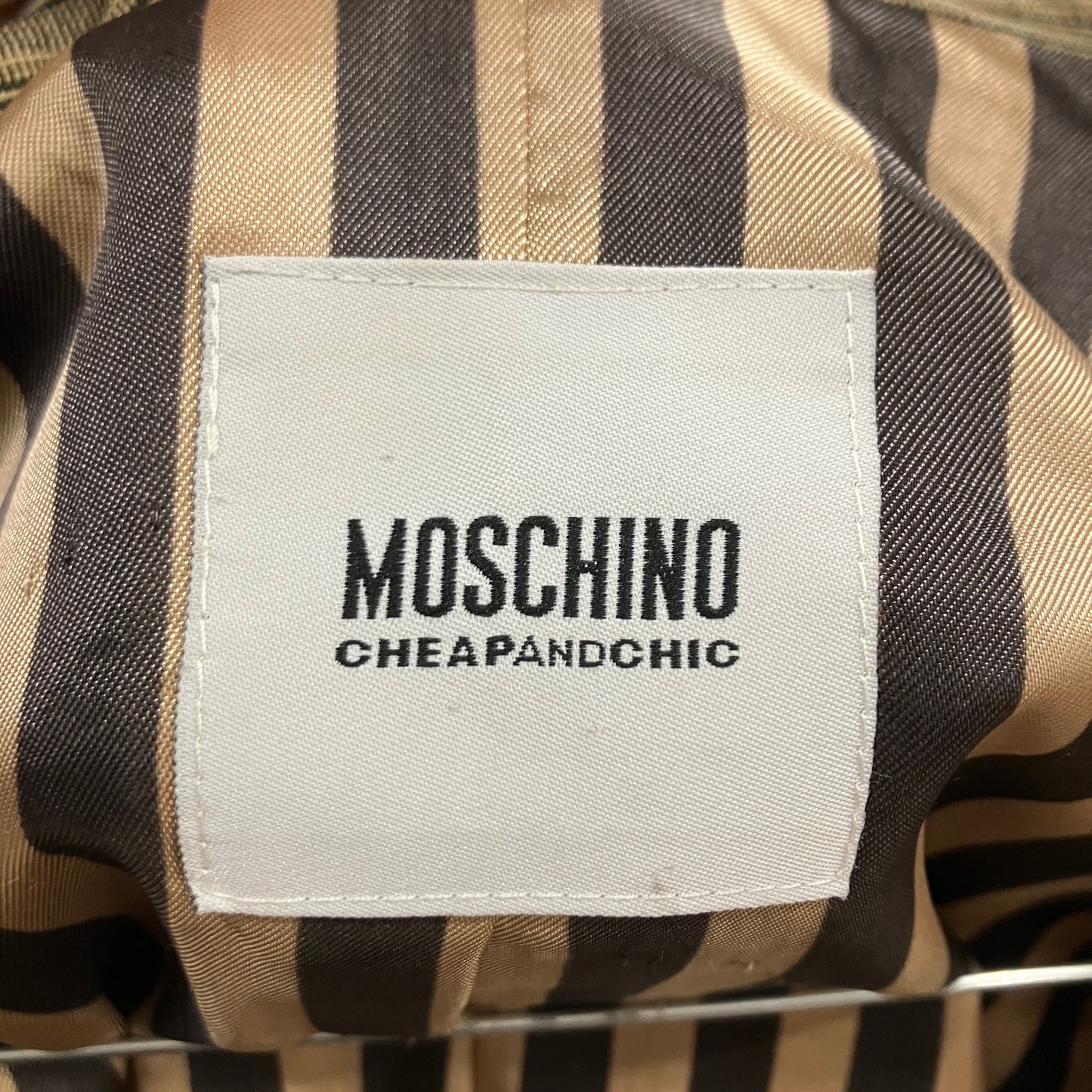 Moschino Cheap & Chic label on a striped garment