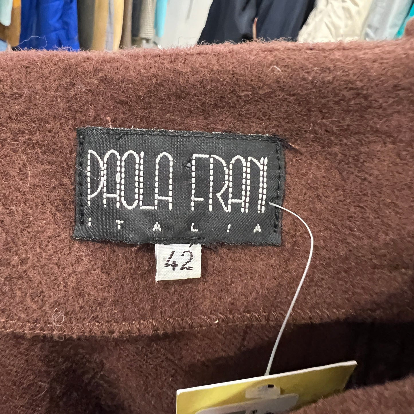 Paola Frani label on a brown garment with size tag
