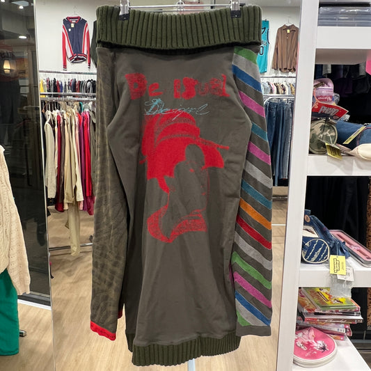 Hanging sweater with colorful patterns in a store setting