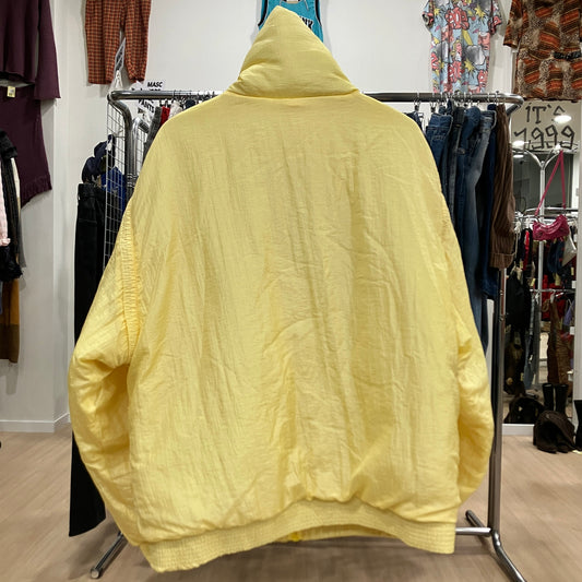 Yellow jacket on a rack in a clothing store