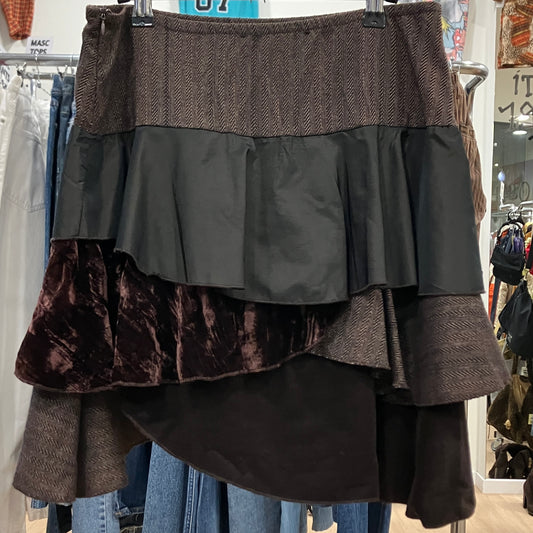 Multicolored layered skirt on a hanger in a store setting