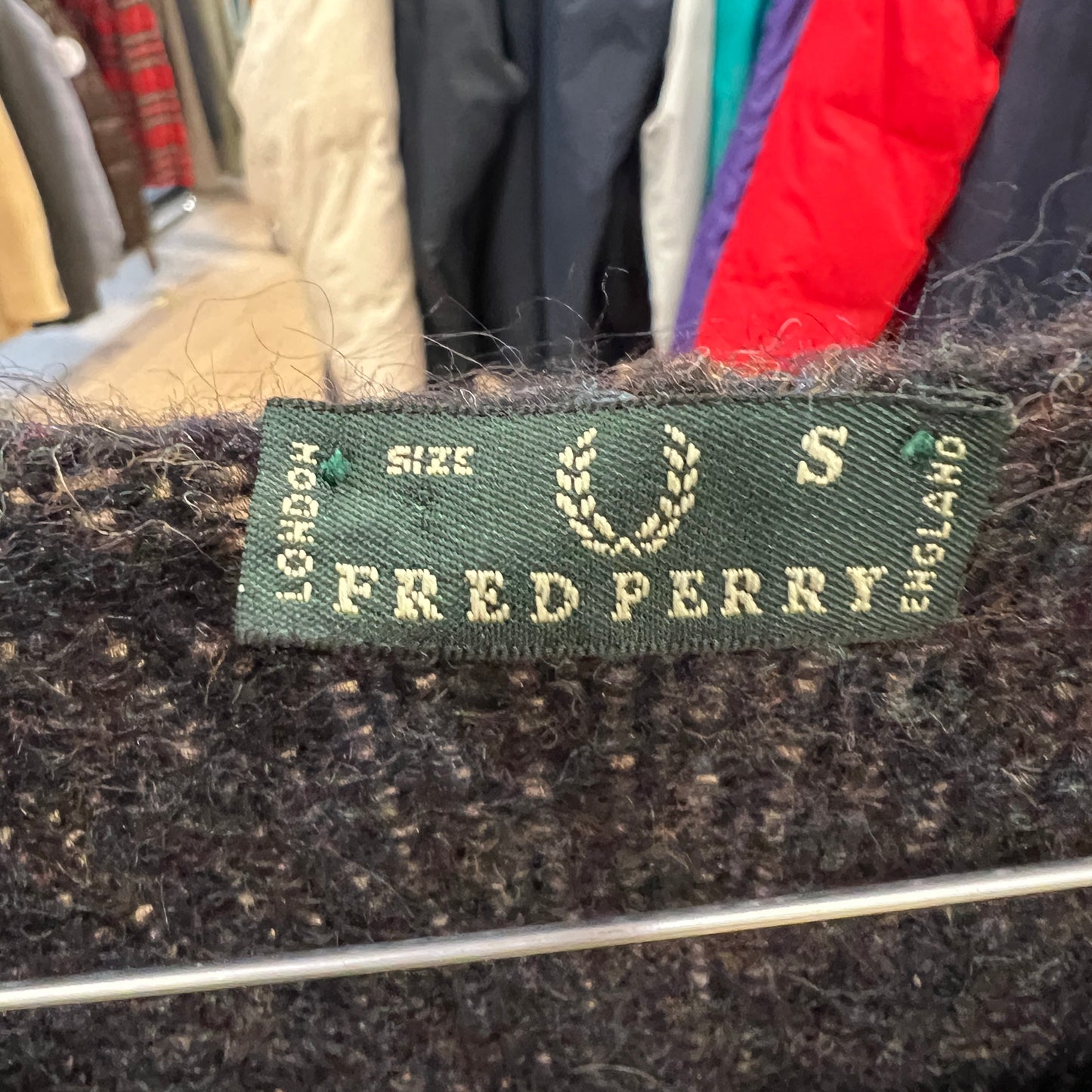Fred Perry label on a textured fabric background