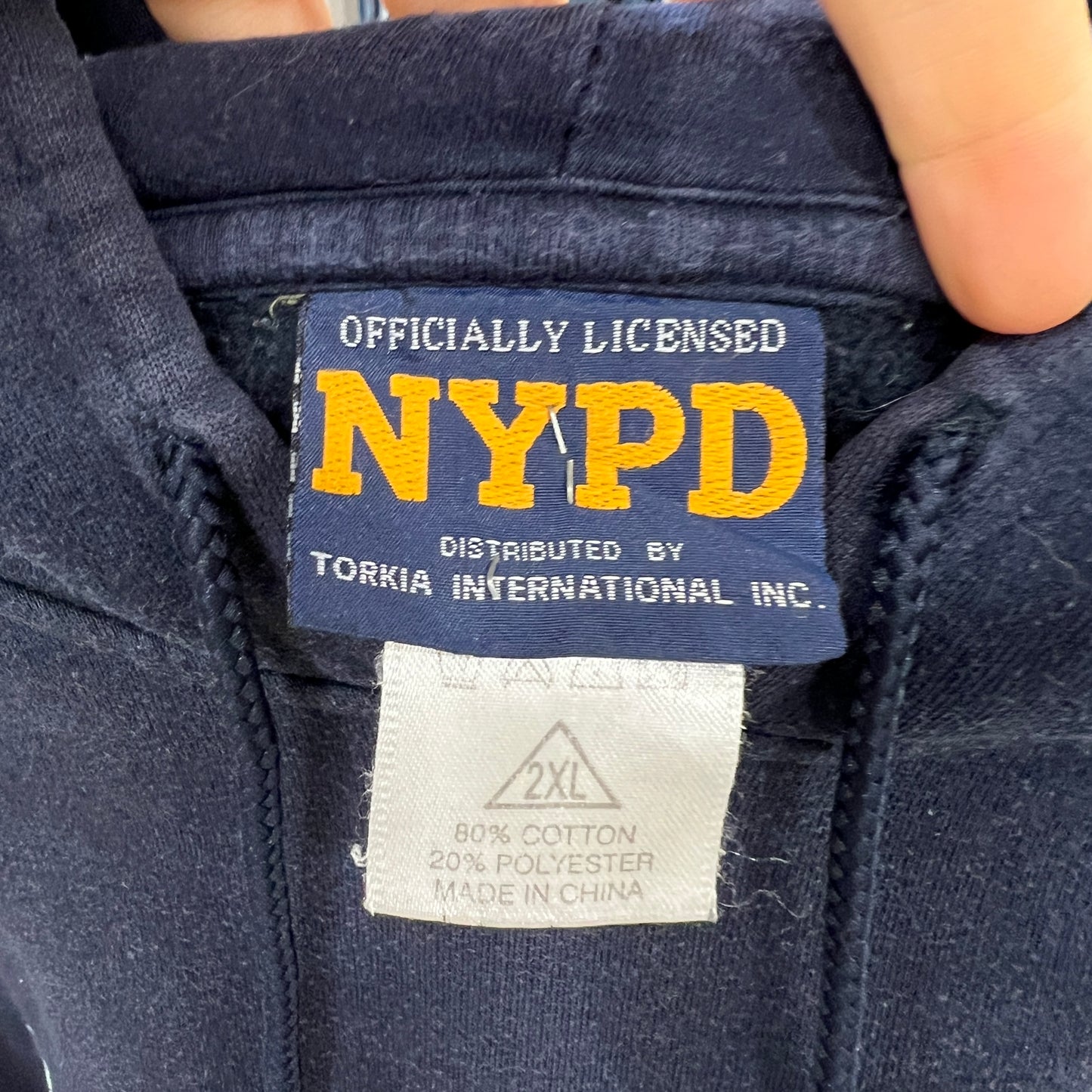 NYPD officially licensed label on a dark sweatshirt