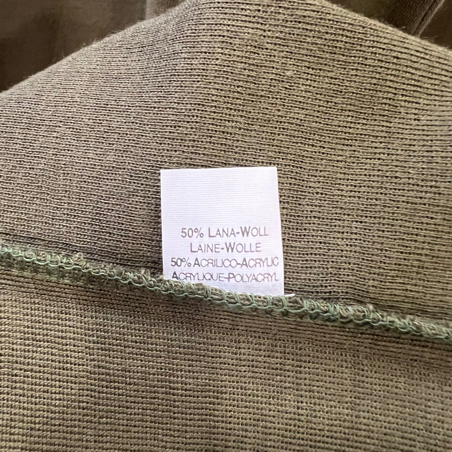 Textile label on a fabric with material composition details