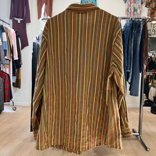 Striped shirt on a hanger in a clothing store setting