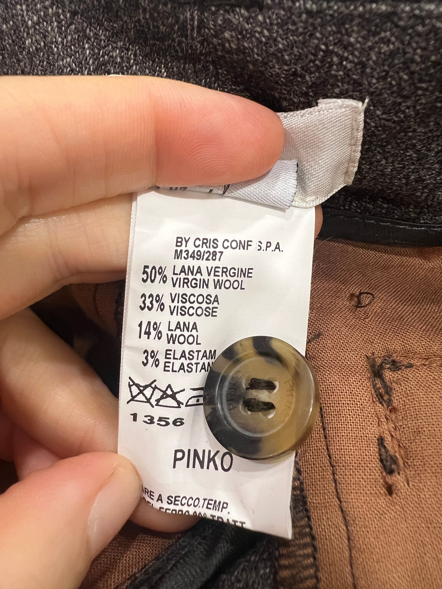 Clothing label with brand name 'Pinko' on a garment