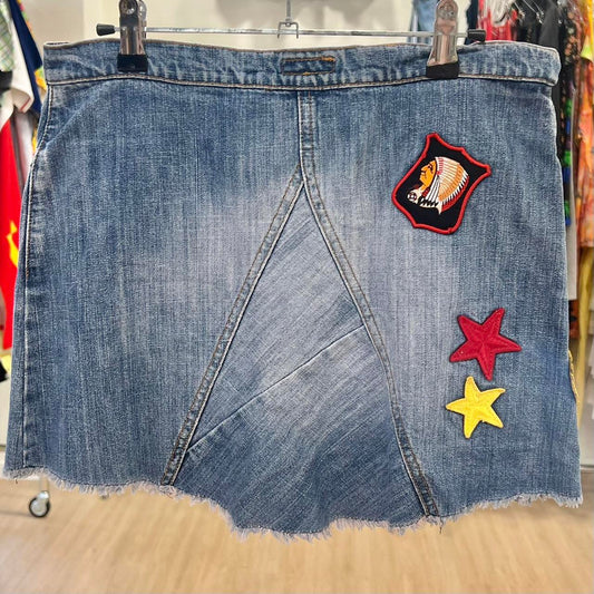 Denim skirt with patches on a rack