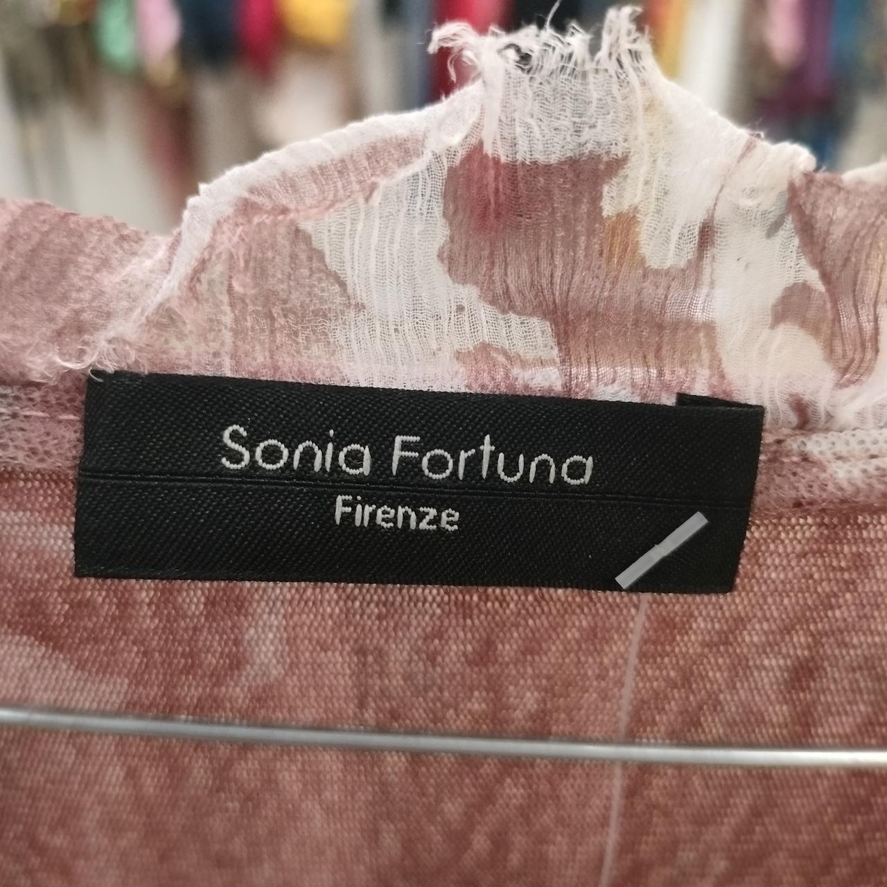 Sonia Fortuna Firenze clothing label on pink floral textured fabric, sustainable fashion