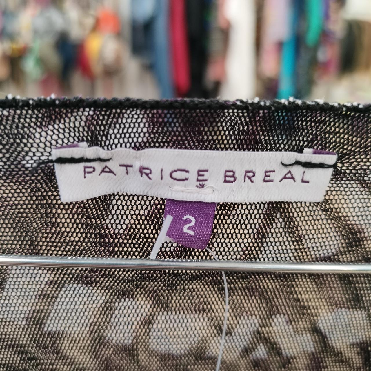 Close-up of Patrice Breal clothing label with size 2 on mesh fabric
