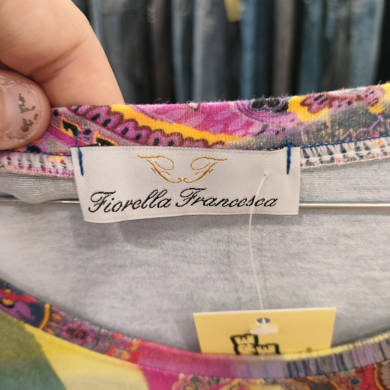 Fiorella Francesca clothing tag on colorful patterned sustainable fashion piece