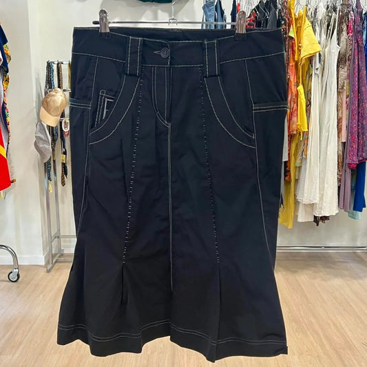 Black denim skirt with contrast stitching on hanger in second hand clothing store