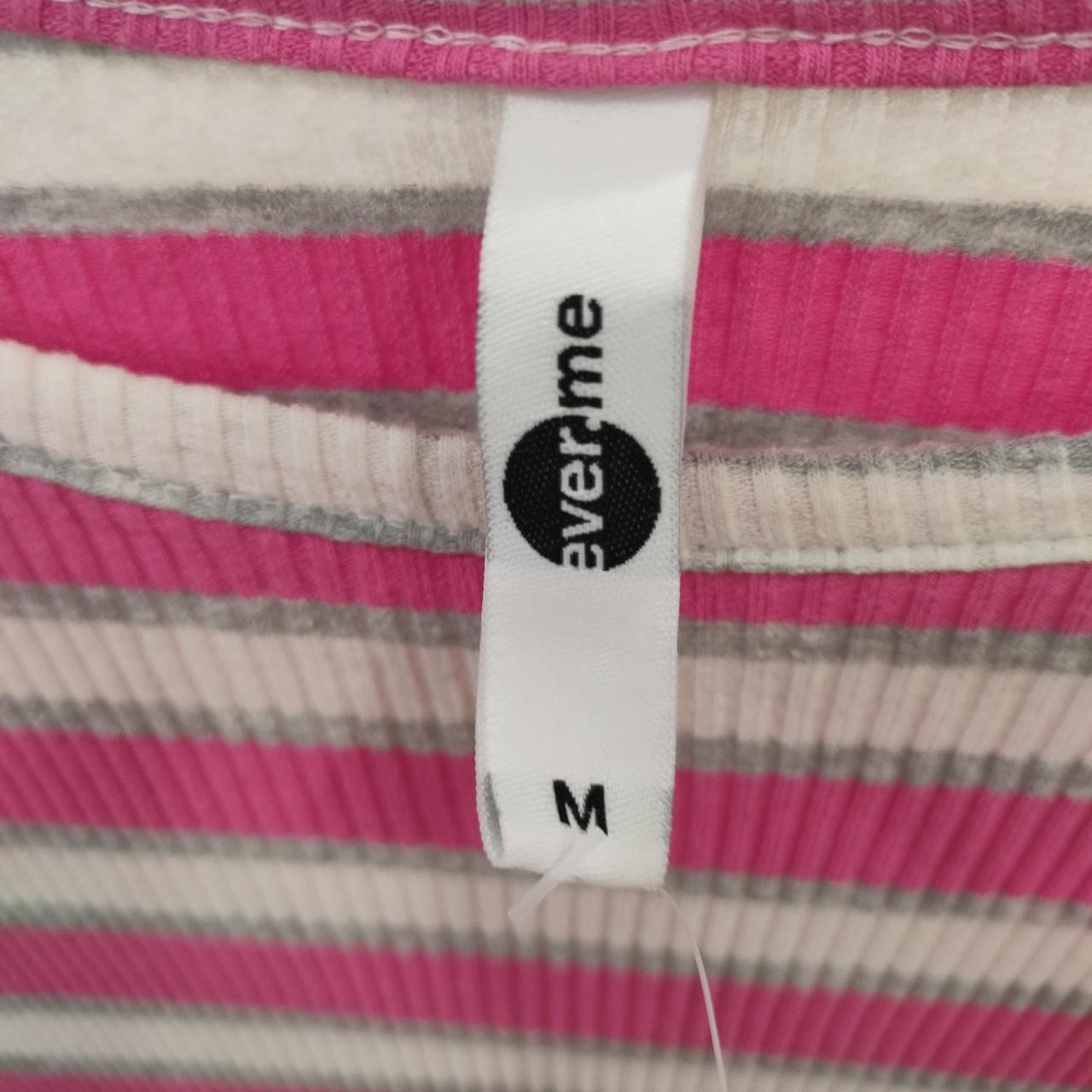 Pink, white, and gray striped ribbed shirt with size M tag