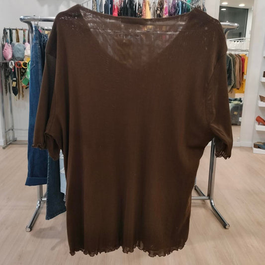 Brown sheer knit top with short sleeves on clothing rack in boutique store