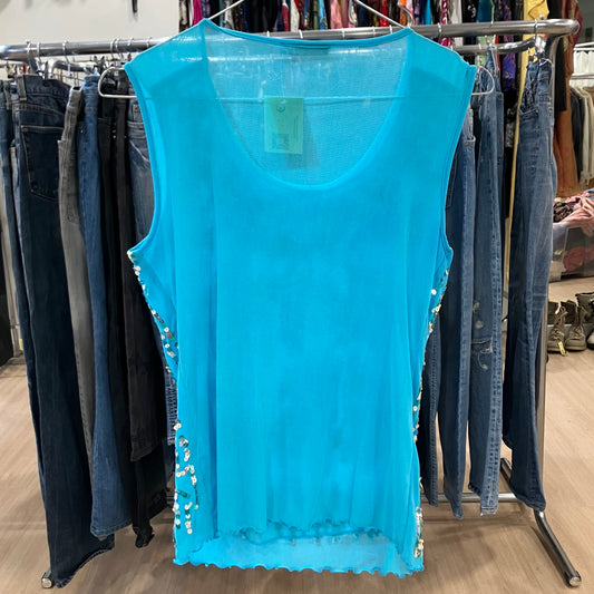Blue sleeveless top with embellishments on a clothing rack in a store