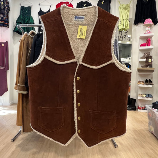 Brown vest with white lining displayed in a store setting
