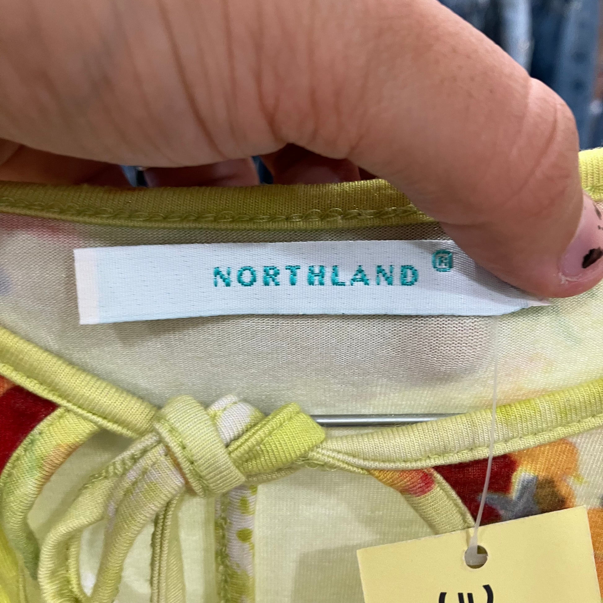 Close-up of a 'Northland' label on a piece of fabric