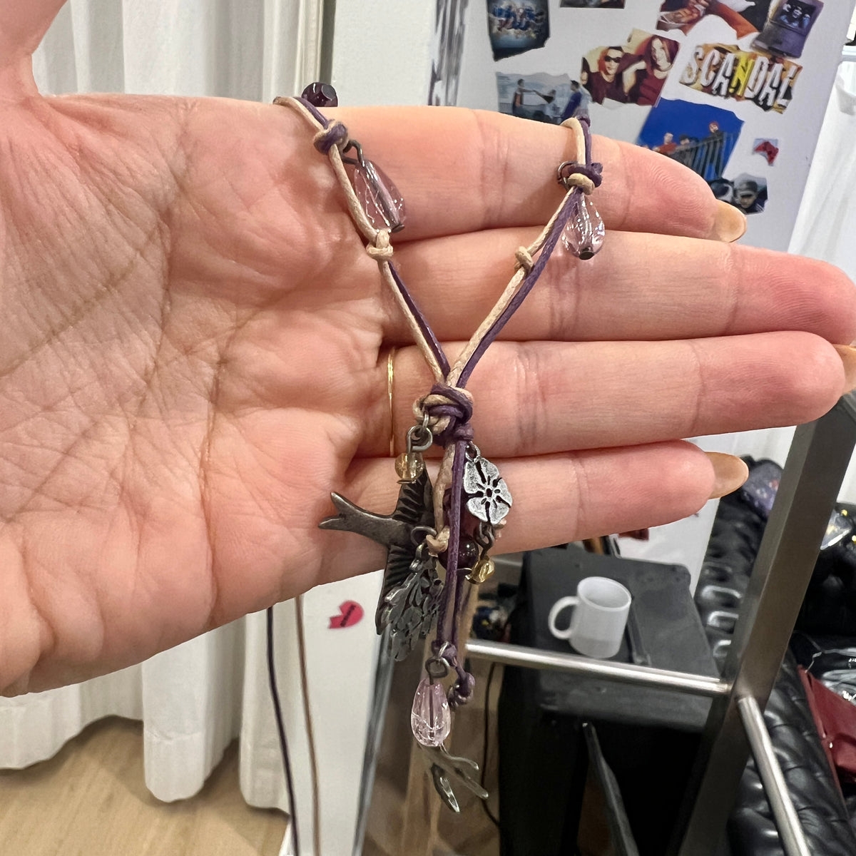 boho whimsy string necklace with silver floral and swallow pendants