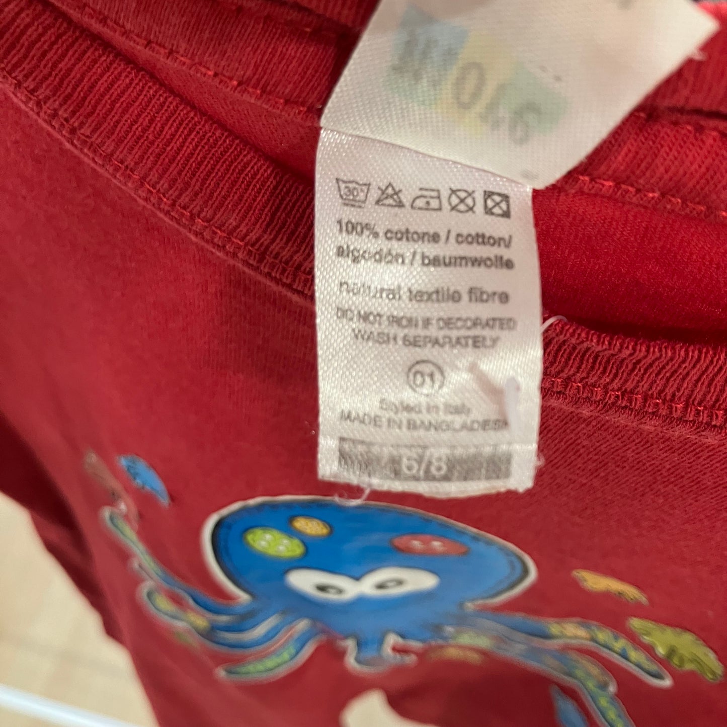 more red tshirt with blue octopus graphic