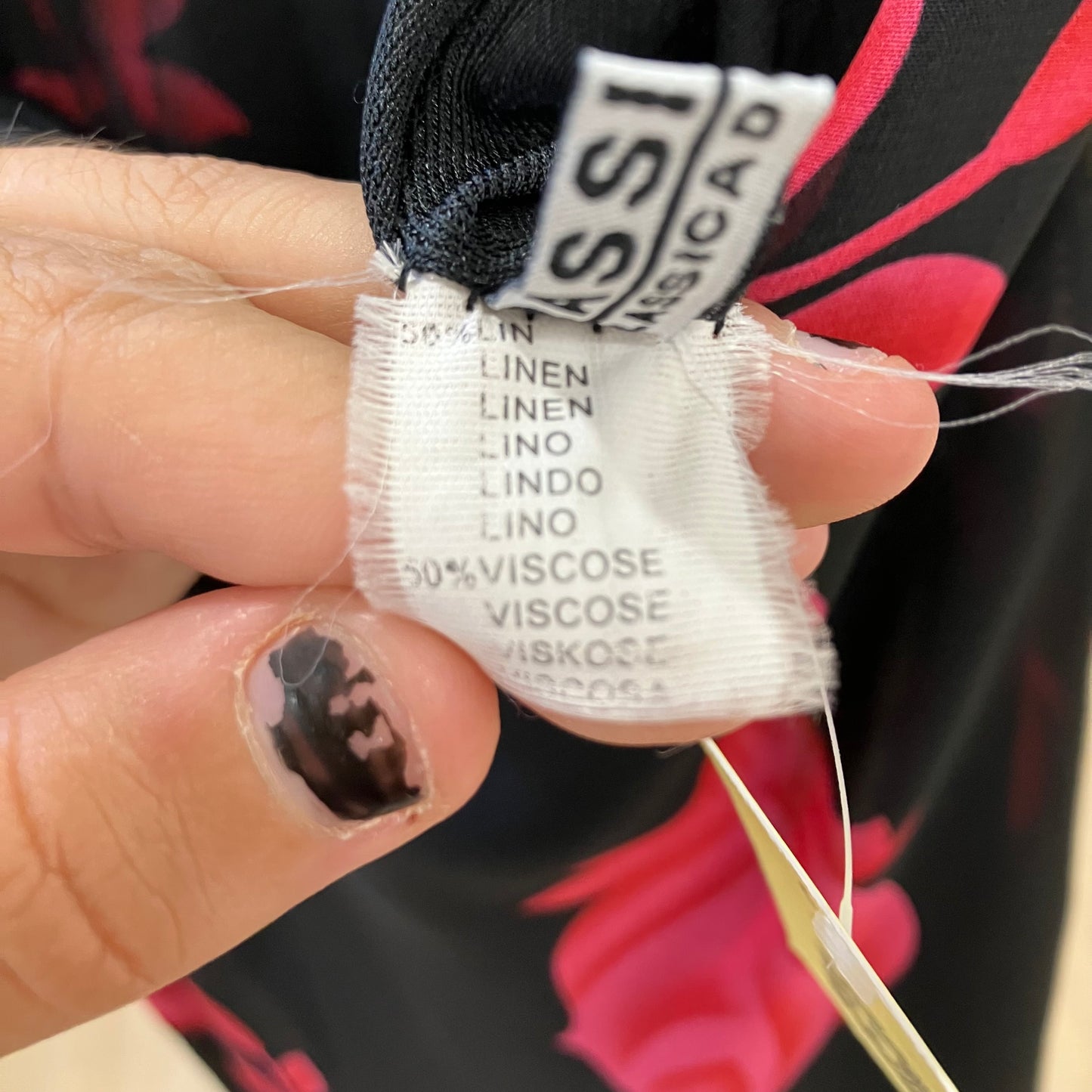 Close-up of a fabric label with text on a blurred background