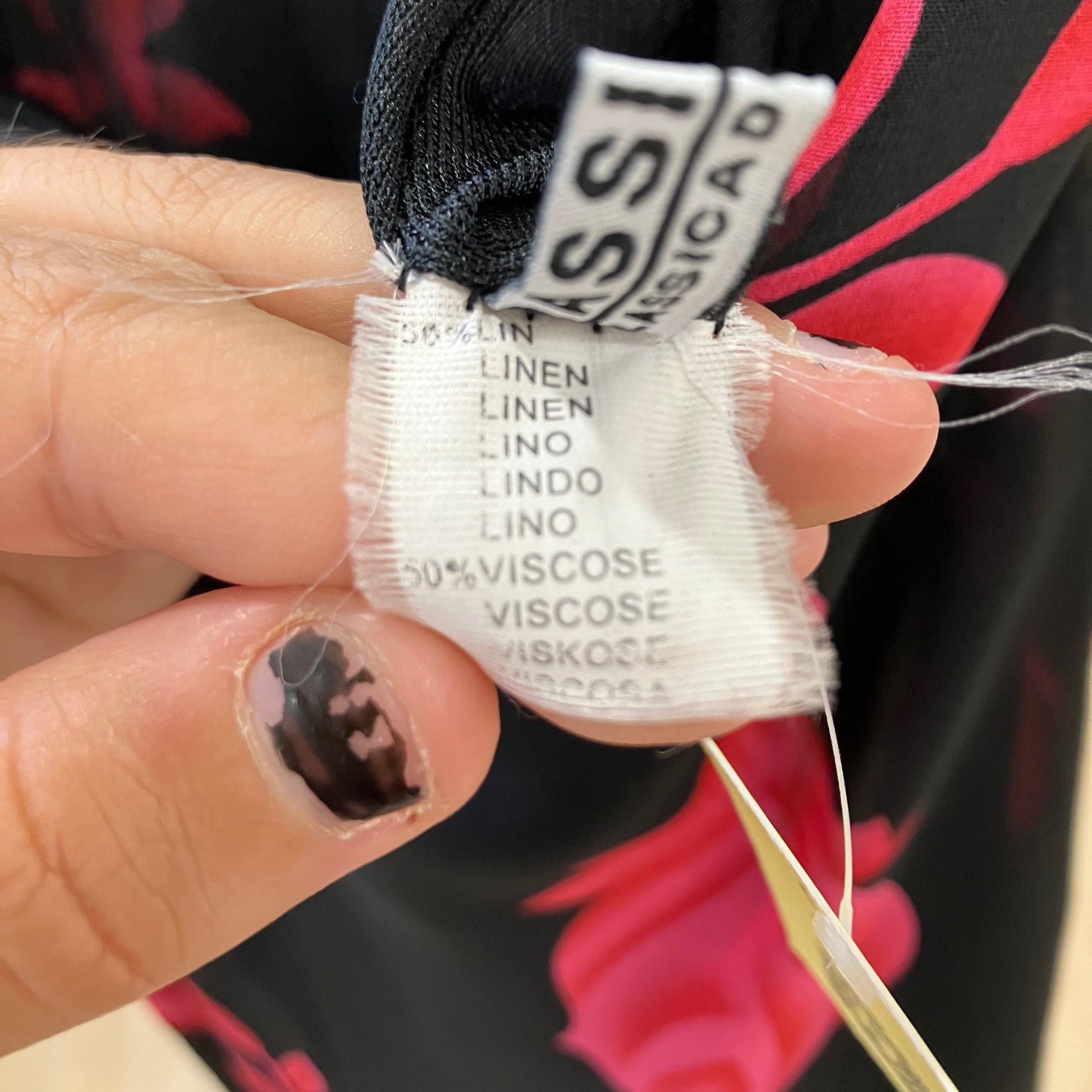 Close-up of a fabric label with text on a blurred background