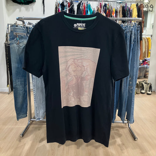 Black t-shirt with graphic design in a clothing store