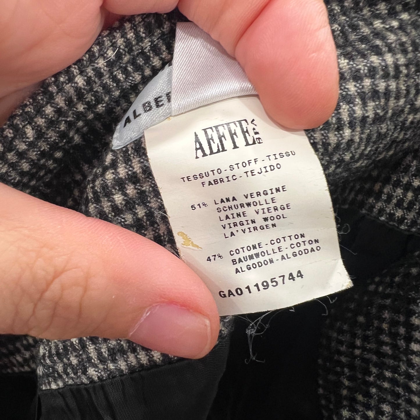 Fabric label on a textured fabric with visible text