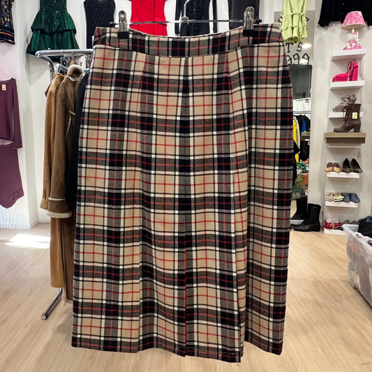 Plaid skirt displayed in a store with clothing and shoes in the background