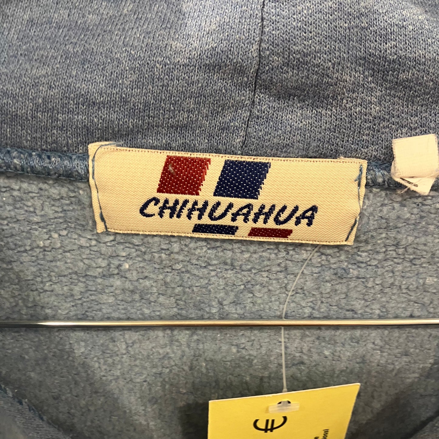 Gray denim jacket with a 'CHIHUAHUA' label on a gray background