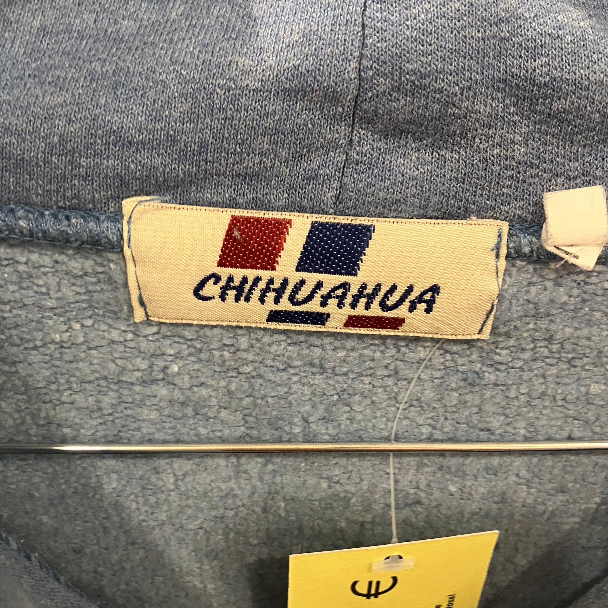 Gray denim jacket with a 'CHIHUAHUA' label on a gray background