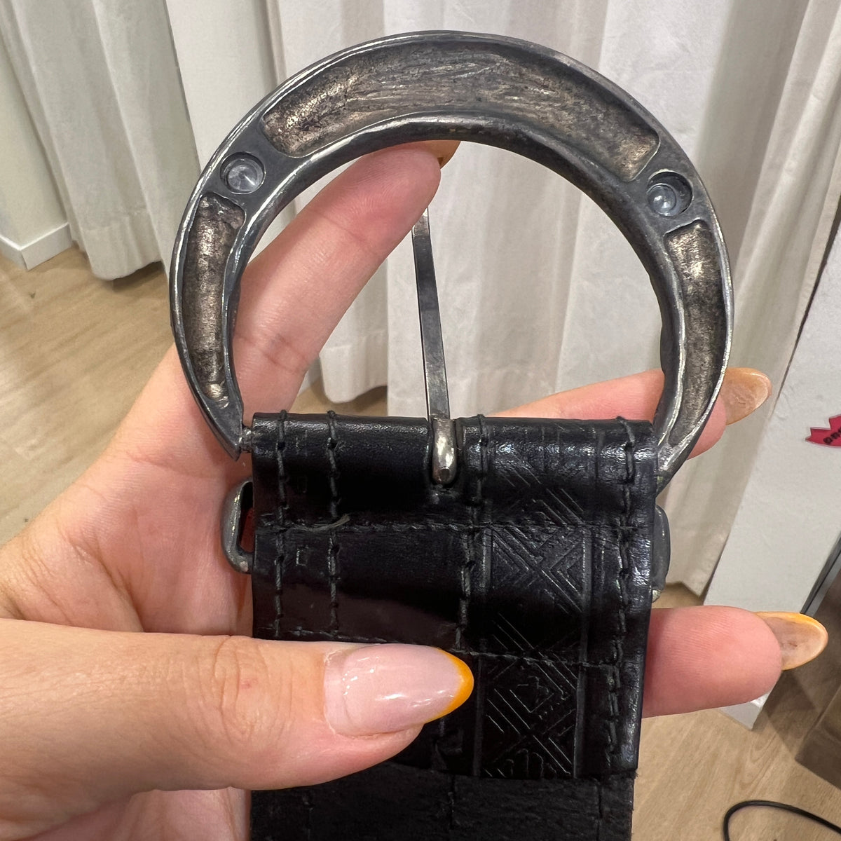 black leather belt embossed with geometric print
