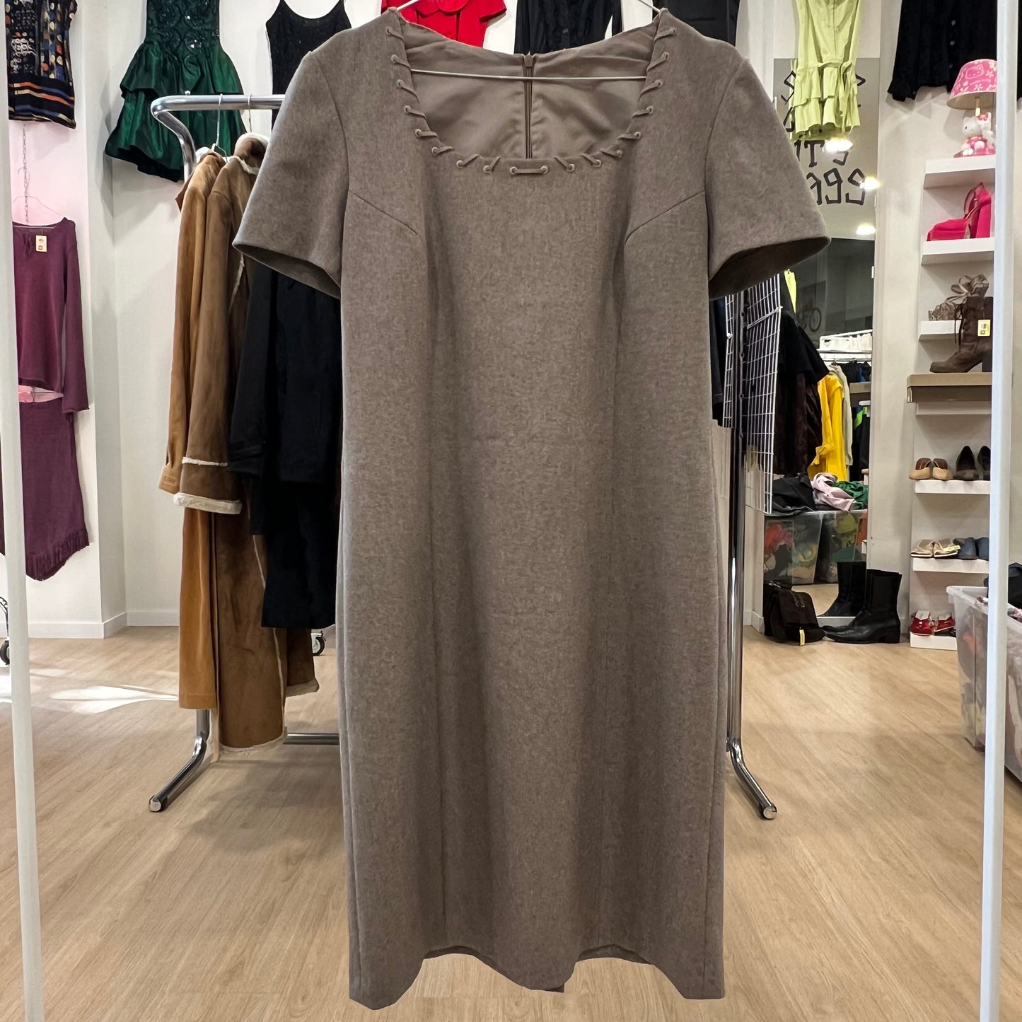 Brown dress on a hanger in a clothing store