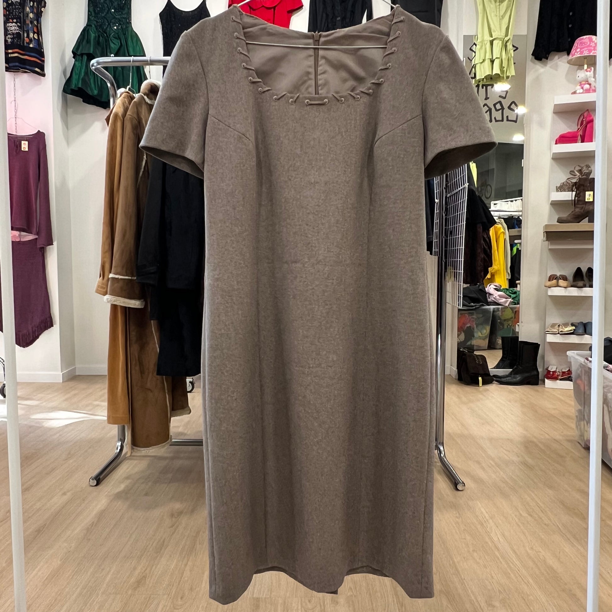 Brown dress on a hanger in a clothing store