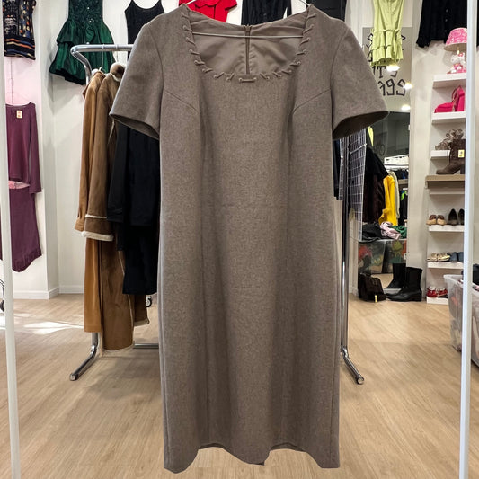 Brown dress on a hanger in a clothing store