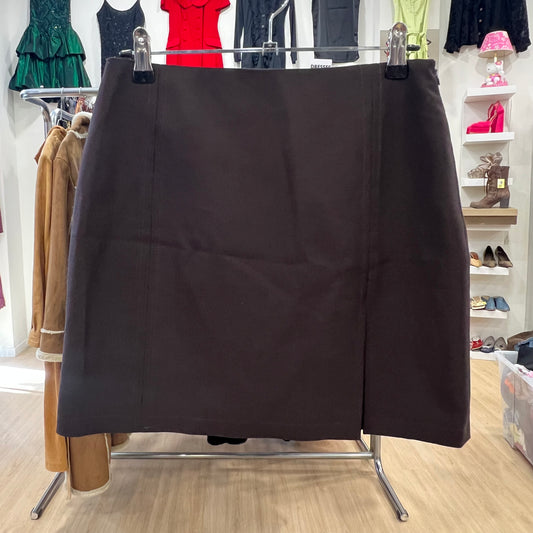 Black skirt hanging on a rack in a clothing store