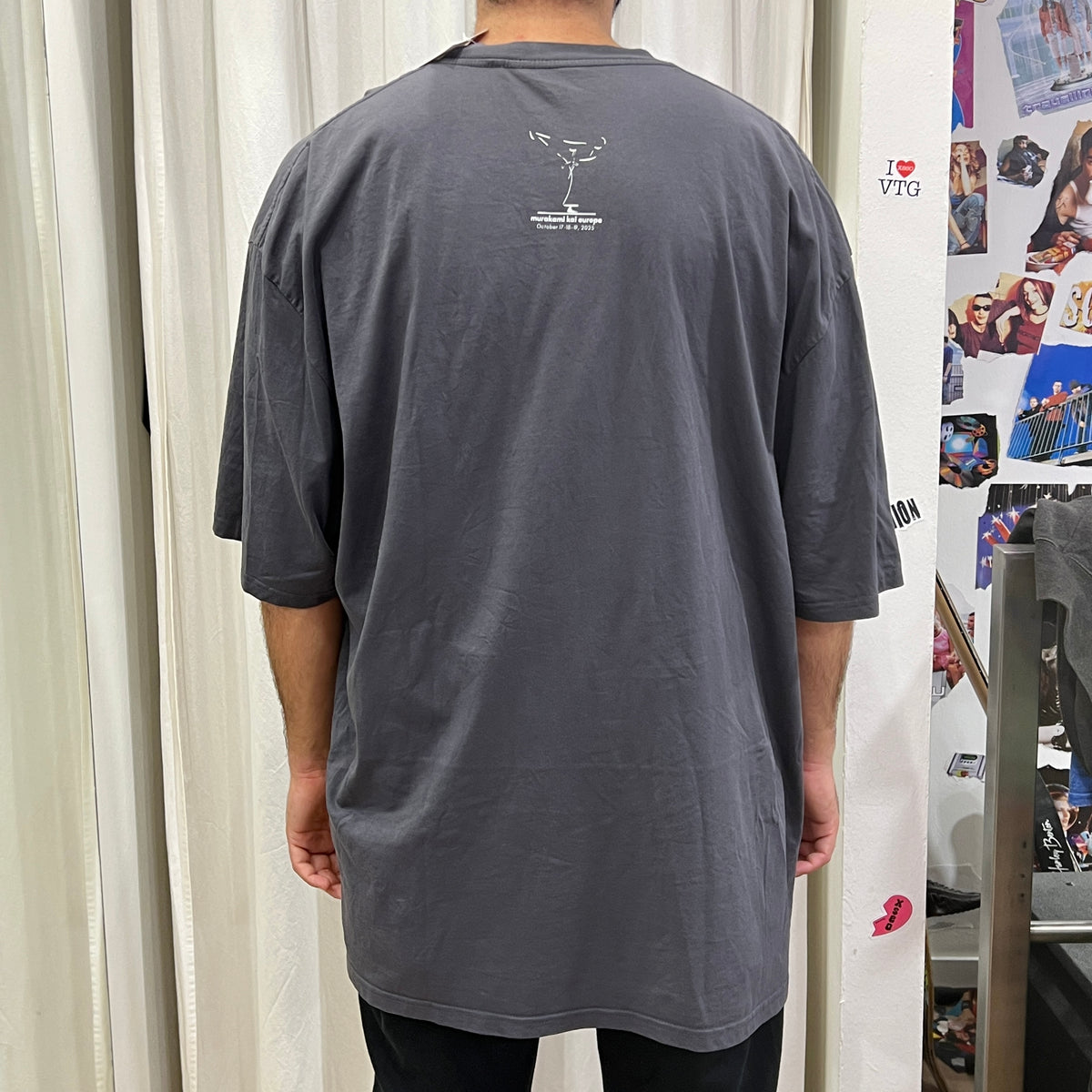 karate event merch grey tshirt with white japanese writing: go beyond your limits