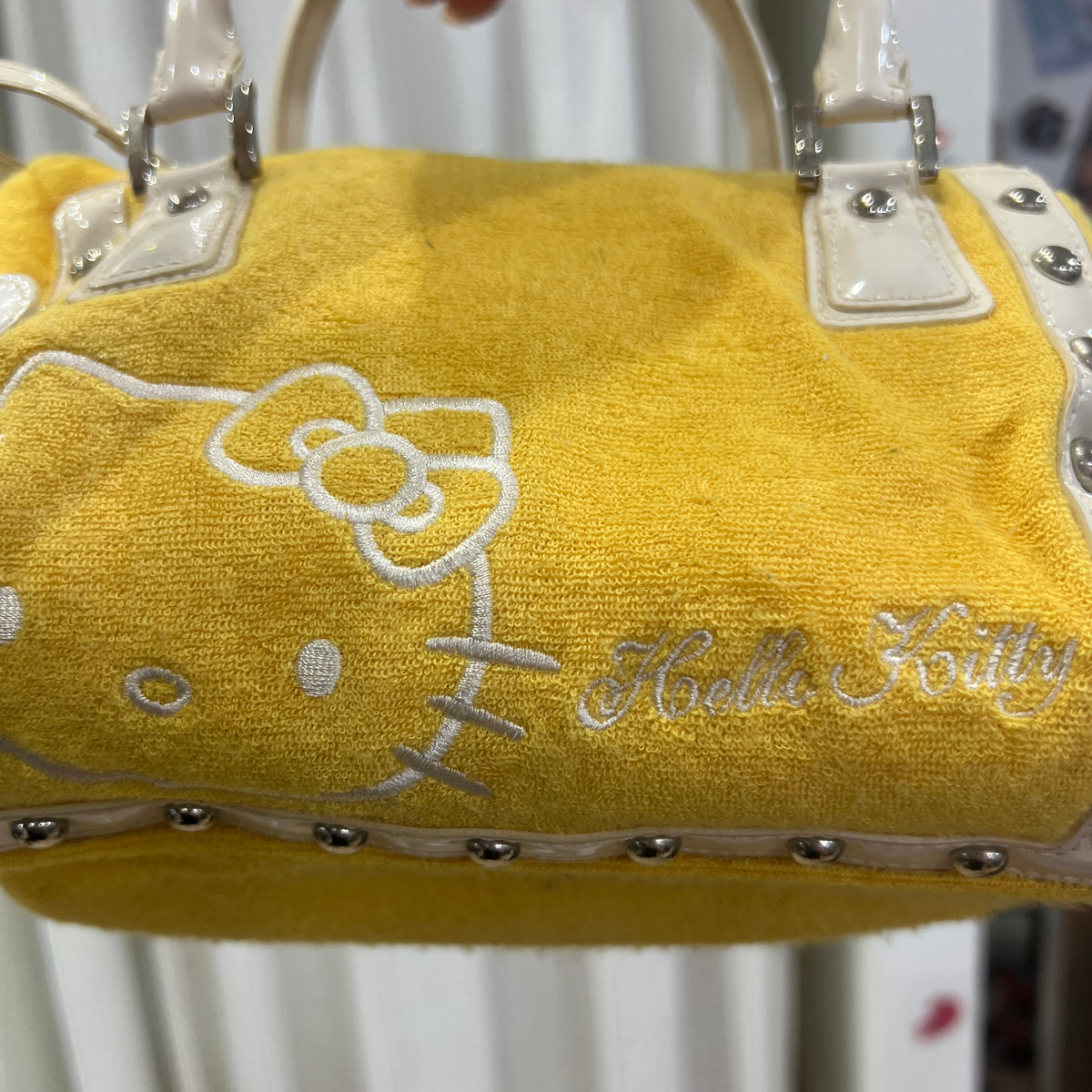 hello kitty sanrio 2007 yellow terry cloth mini trunk bag with white details and silver studs
