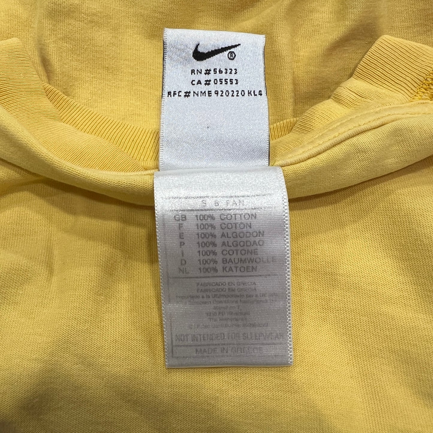 nike 00s yellow tshirt with black swoosh logo