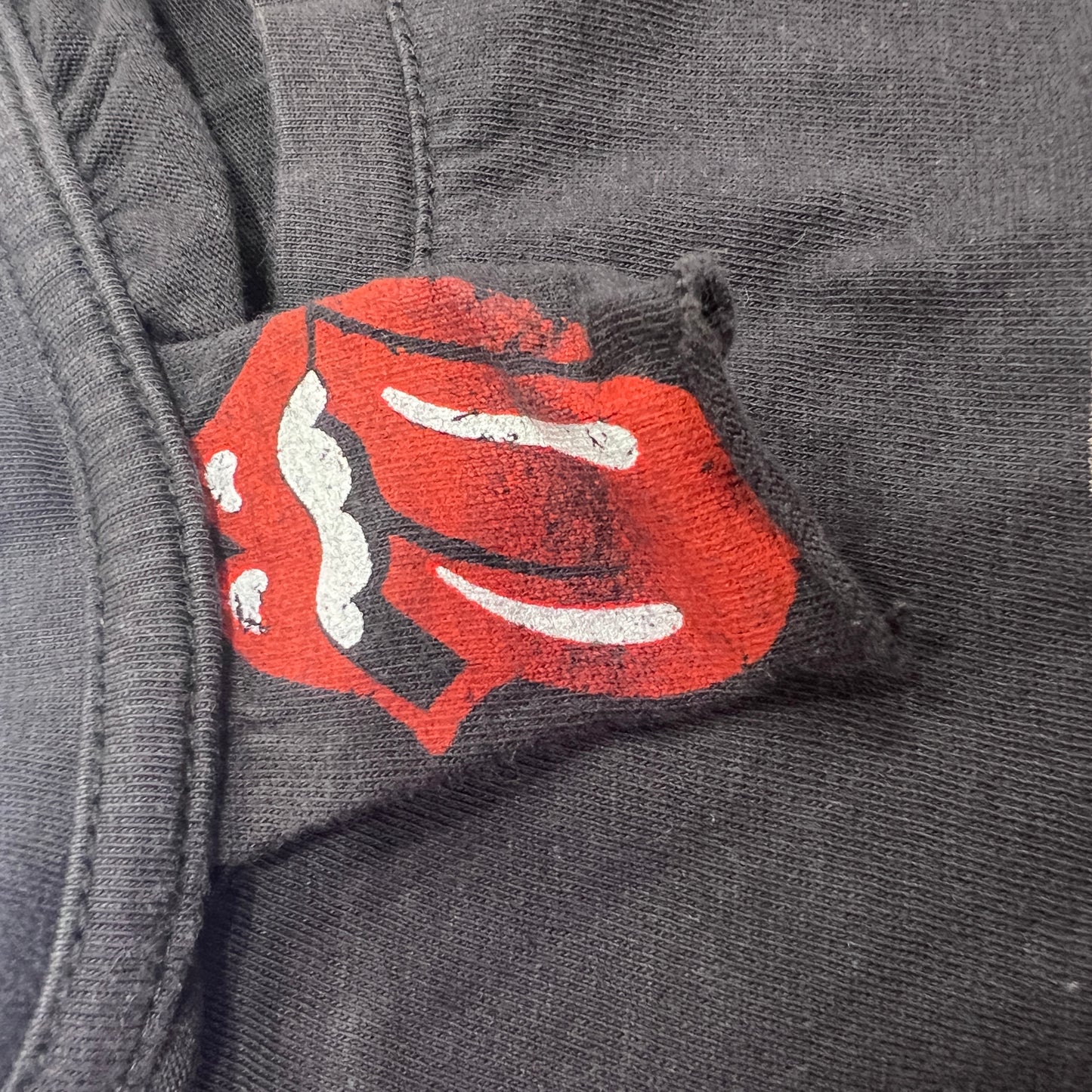 rolling stones 2012 black tshirt with tongue wearing headphones